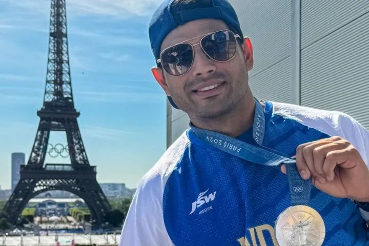 Neeraj Chopra Celebrates Silver Medal with Eiffel Tower Backdrop