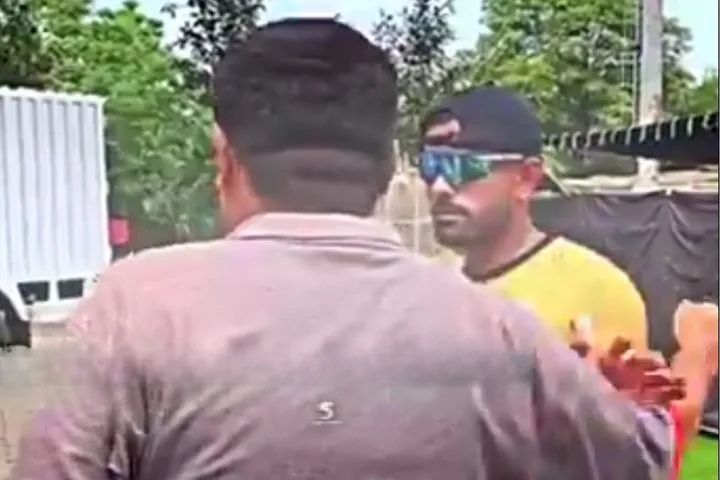 Babar Azam was seen pushing a fan’s hand off his shoulder